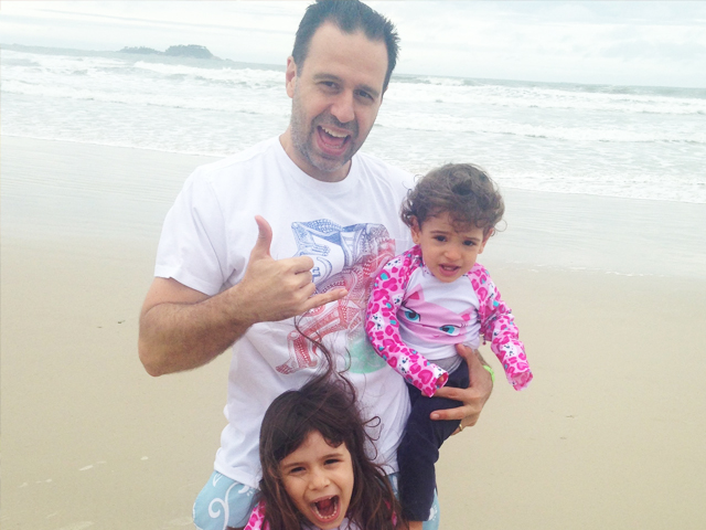 Photo of Luis and children at beach