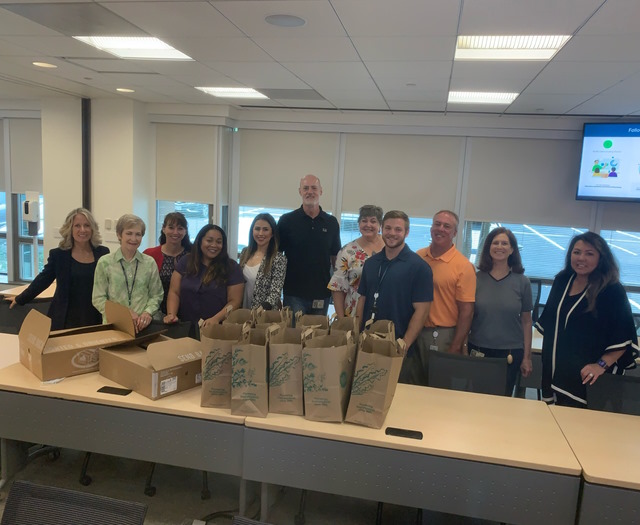 Ronni with her team in 2022, preparing lunches for the Embry Rucker Shelter in Virginia, near Cisco's Herndon office.