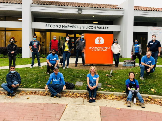 A group of Cisco volunteers pose for a picture outside the Second Harvest of Silicon Valley headquarters.