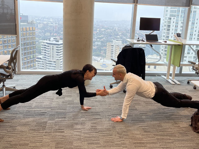 Two people doing yoga