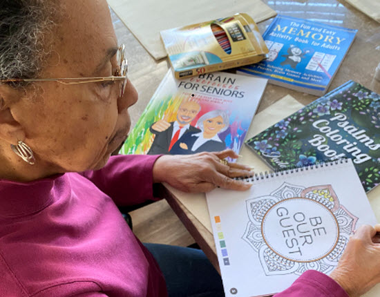 Linda Ann  enjoys the engaging activities at the day center.