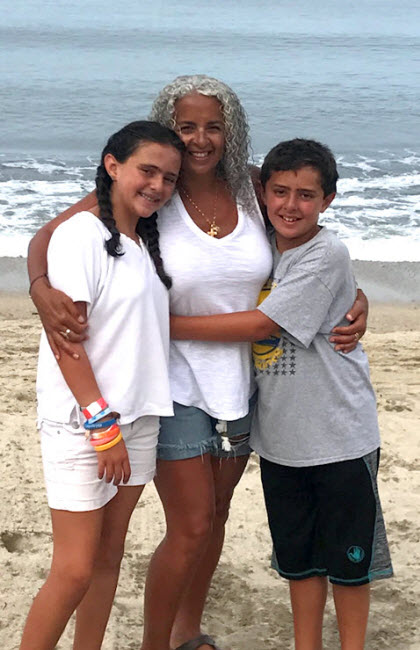 Connie with her kids in Mexico last year. Beach is her happy place, and Mexico is a frequent destination.