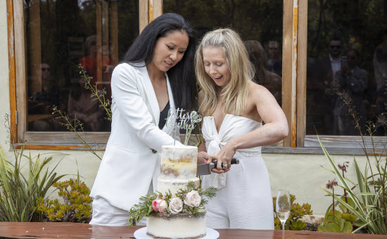 Genevieve (left) and Rachelle cutting the cake at their engagement party in November 2019.