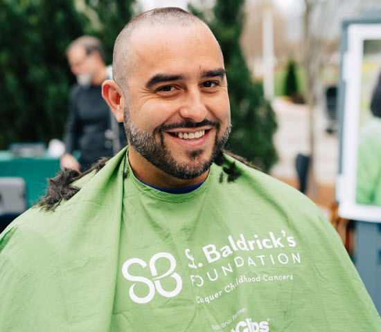 Andres shaving his head for St. Baldricks.