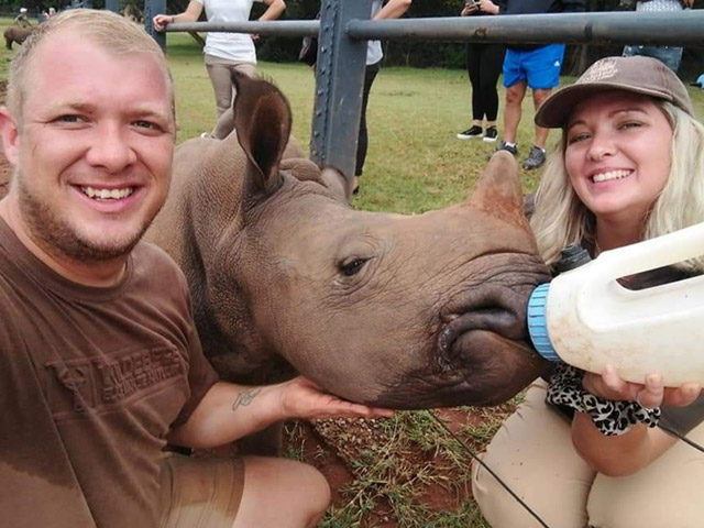 Marlize and her brother at a rhino orphanage