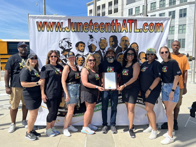 Aleta poses with fellow Cisco employees at the Juneteenth Festival in Atlanta in 2022