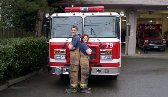 Scott and his wife Heather with the fire engine he helped design.
