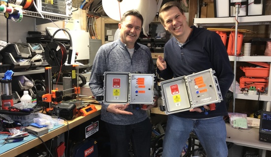 Scott and Andrew Smallridge with a prototype wildfire sensor.