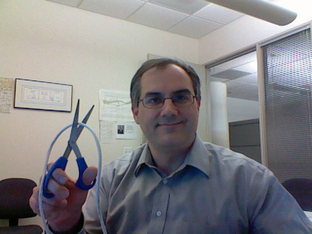 Photo of Phil cutting the Ethernet cord