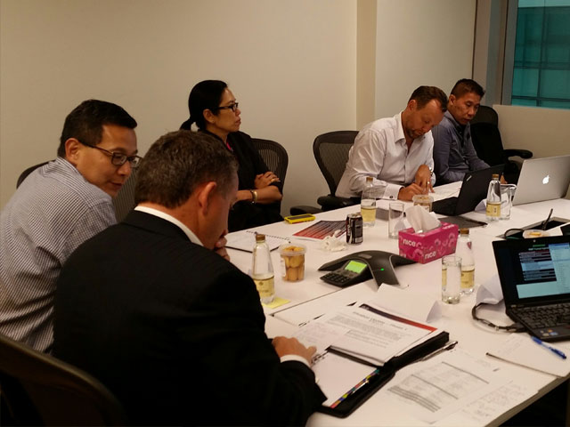 The Incident Management team in Singapore preparing for a drill with regional executives in attendance.