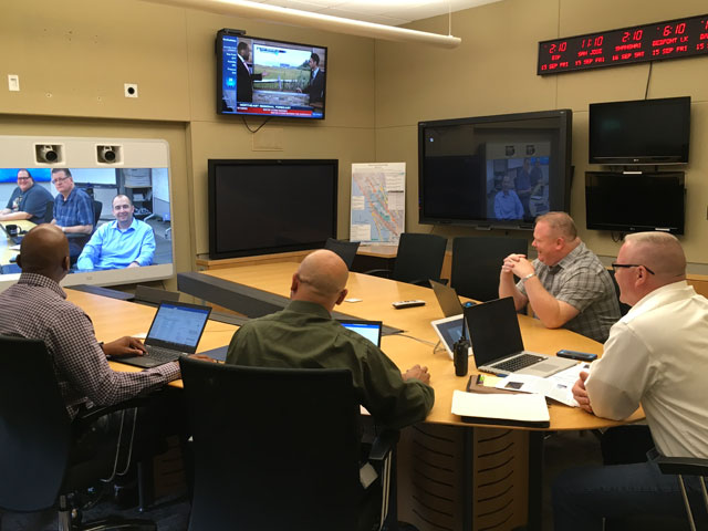The Incident Management Team in San Jose bridged via TelePresence with RTP discussing Hurricane Irma.
