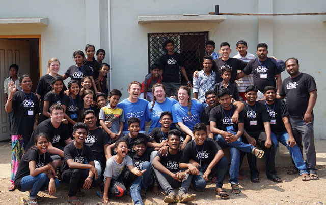 Cisco volunteers work together with orphanage employees, school teachers, and children.