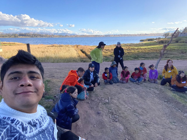 Jair and a group of people gathered in a circle.