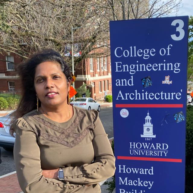 Hepsi Premkumar standing in front of College of Engineering and Architecture sign at Howard University