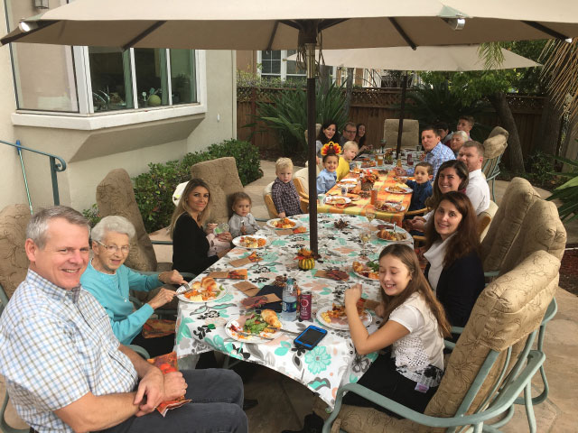 Enjoying a family dinner — my  wheelchair is hidden from view.