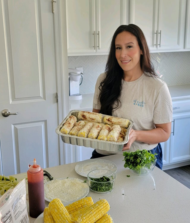 Claudia making traditional Spanish corn for the Conéxion RTP Chapter Potluck in North Carolina.