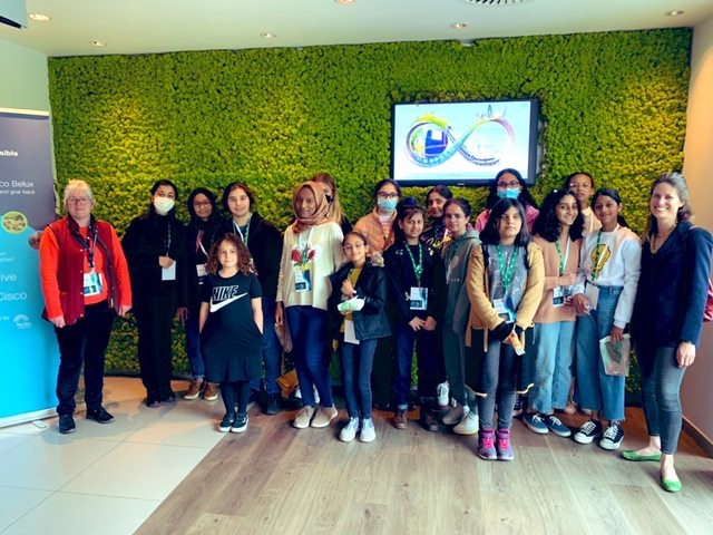 A group of girls and their  two teachers at a Cisco Belgium office on International Girls in ICT Day 2022.