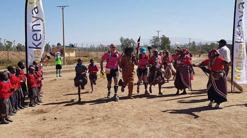 Laurent and Dominique running into Gilgil with  Kenyan children.