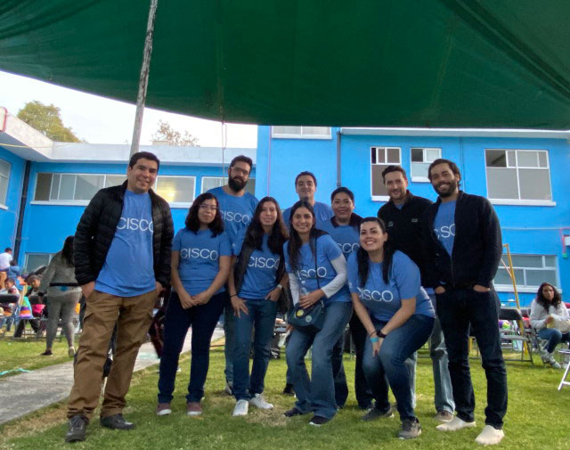 Mariuska (second from  right in the front row) and part of her team supporting La Cruz Blanca, an organization  in Mexico City that helps kids from low income families or foster homes with  nutritional issues.  