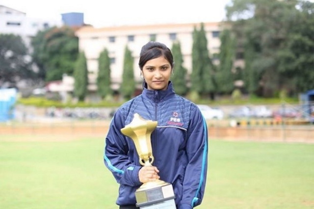 Nammi poses with a trophy at the People’s Education Society Institute of Technology in Bengaluru, India. 