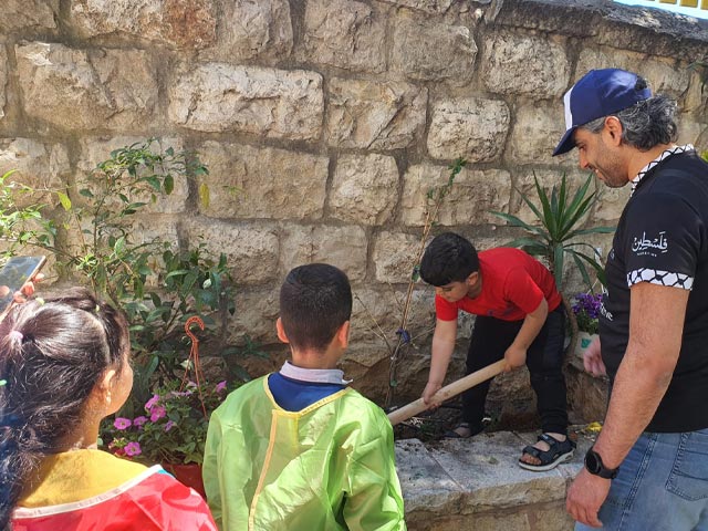 Spending quality time with kids and their families at Huda Al Masri Healing Garden in Bethlehem.