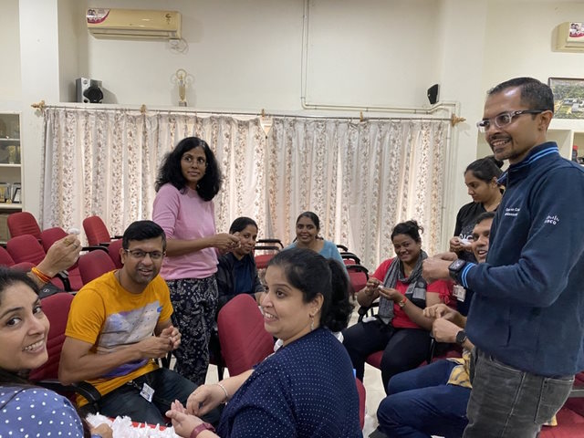 President of Cisco India and SAARC Daisy Chittilapilly volunteering to make cotton balls for patient care with her team at Karunashraya Bangalore Hospice Trust.