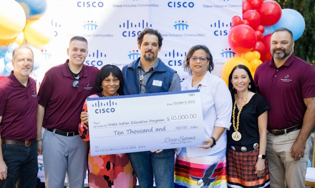 Chief Diversity, Equity, and Inclusion Officer Gloria Goins with members of the Cisco Native American Network present a $10,000 Cisco donation to James Freeman and Rebecca Locklear of the Wake Indian Education Program at the RTP Land Acknowledgment Ceremony.