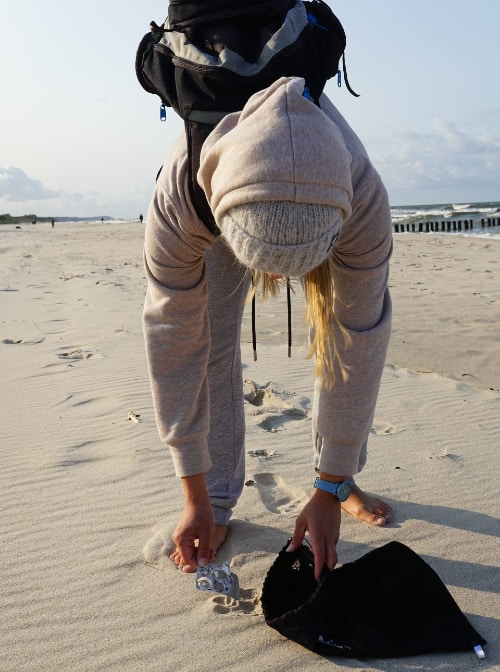 Gosia uses her eco bag to clean up a Hel Peninsula beach along the Baltic Sea.