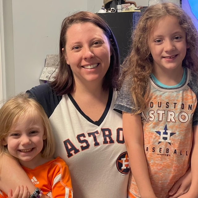 Deidre and her daughters, Aria, 3 and Ava, 7. Partial hearing definitely comes in handy when both of their tablets are on at full blast.