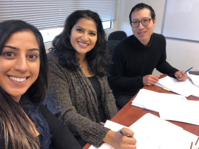 Tanjeev (left) and Reyhan (middle) at an  Eviction Defense clinic in 2019.