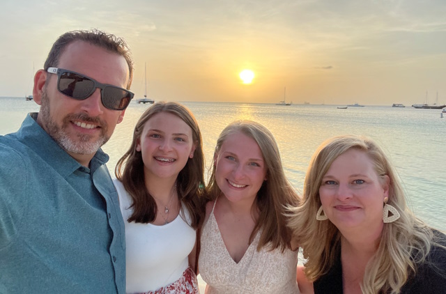 Chris with his family  at the beach.