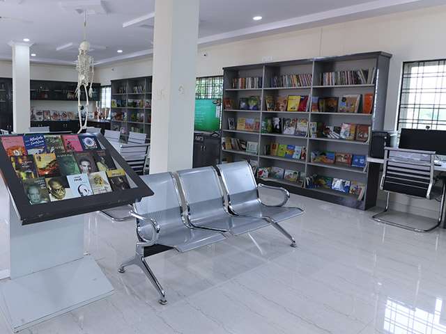 The library’s shelves stocked with fiction and nonfiction books.