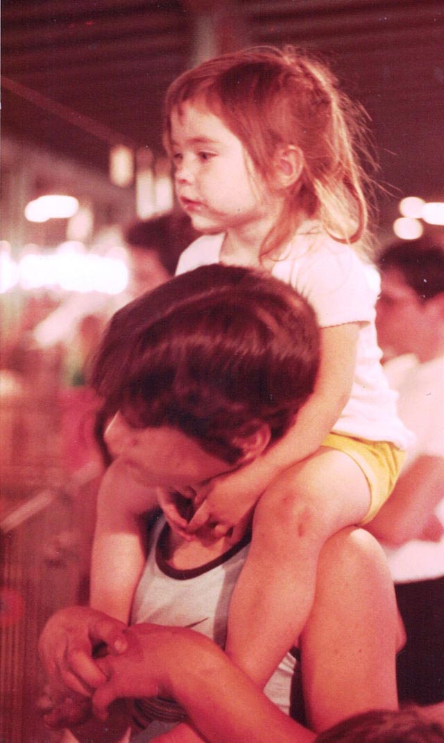 Brian holding Meghan on his shoulders at the fair in 1983.