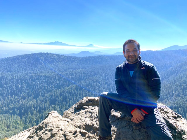 Hugo on a hike in a mountainous area.