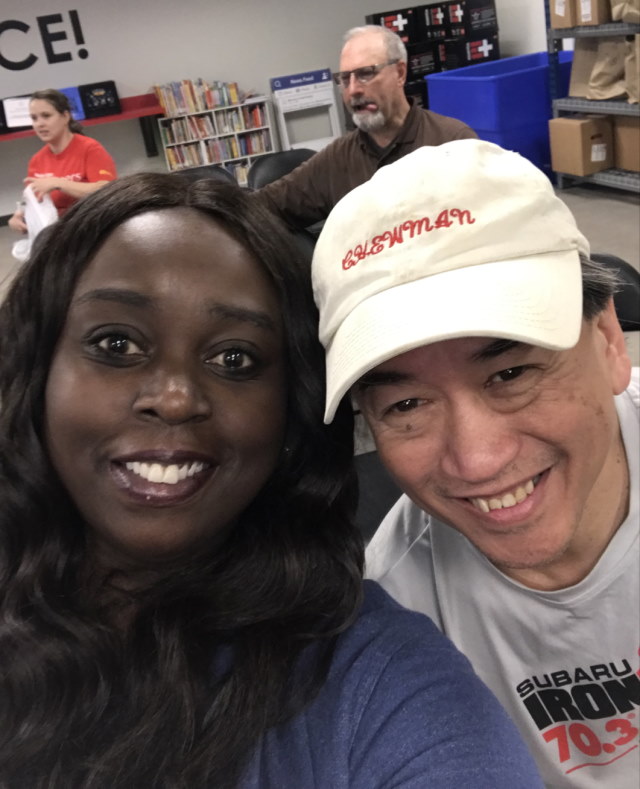 Melissa with  colleague Clifford Chew during a volunteering event at Mimi's  Food Pantry.