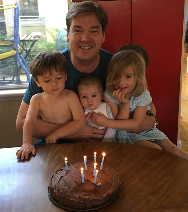 Oliver with his three children on his birthday last year. Amara was 6 months old.